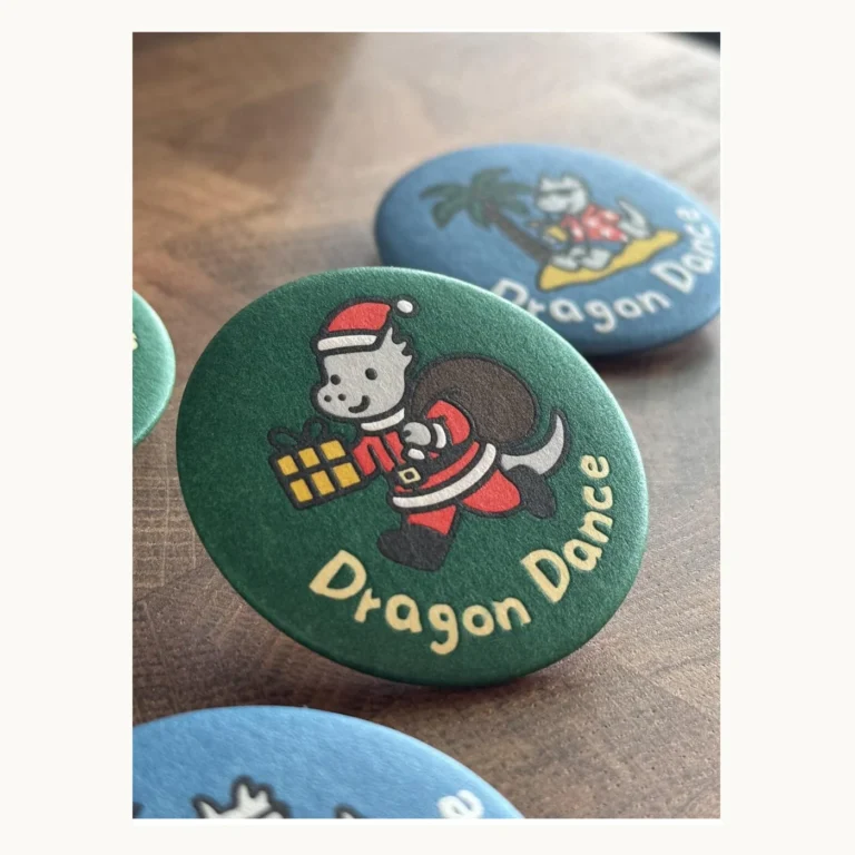 Photograph of Dragon Dance Christmas Paper Badges