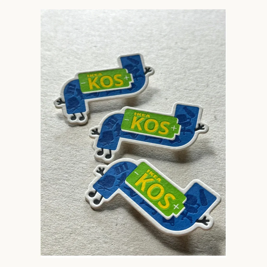 Photograph of Blue and Green Five-Color Letterpress Paper Badges