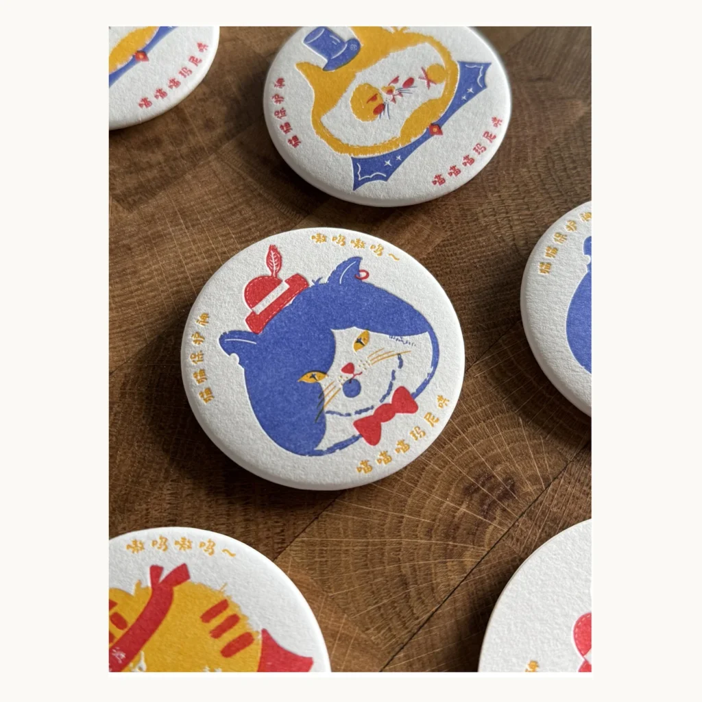 Photograph of Three Guardian Cats Letterpress Badge and Magnet Set