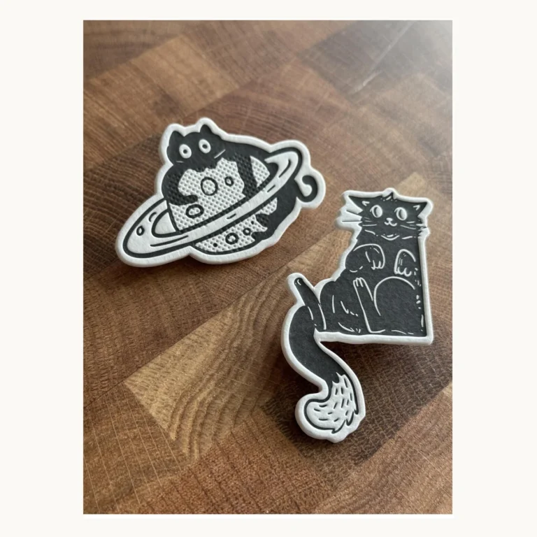 Photograph of Black Cat and Planet Letterpress Paper Badge