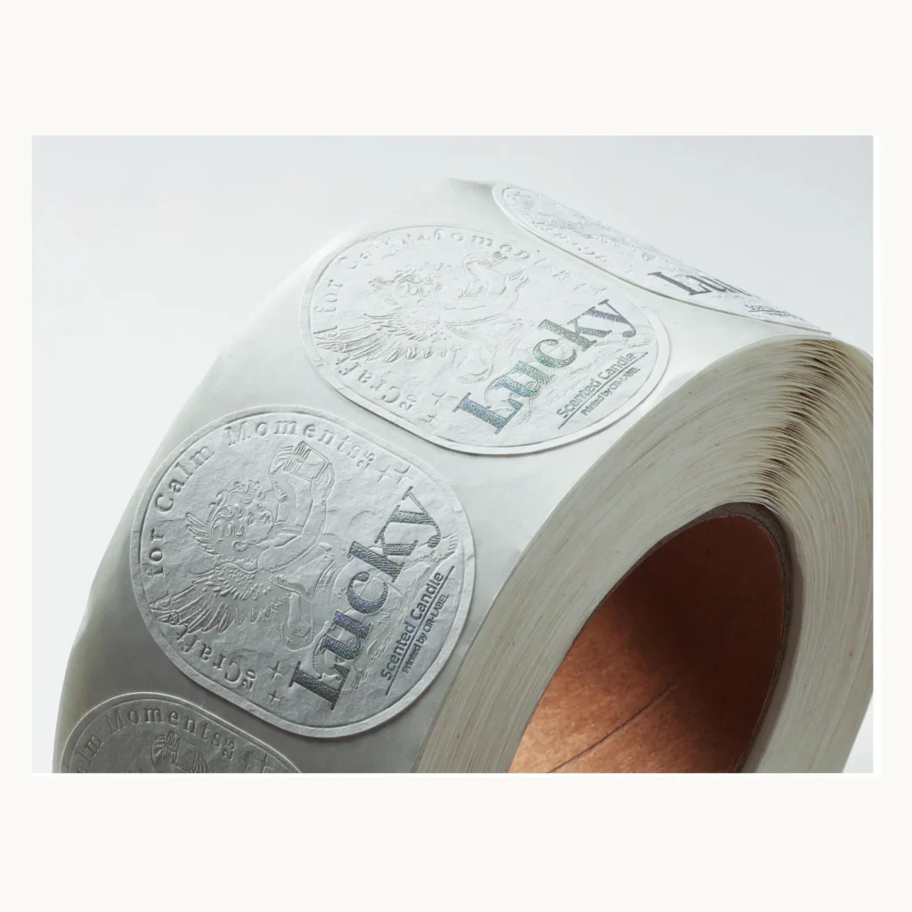 Photograph of White Candle Labels with Blind Relief Pattern