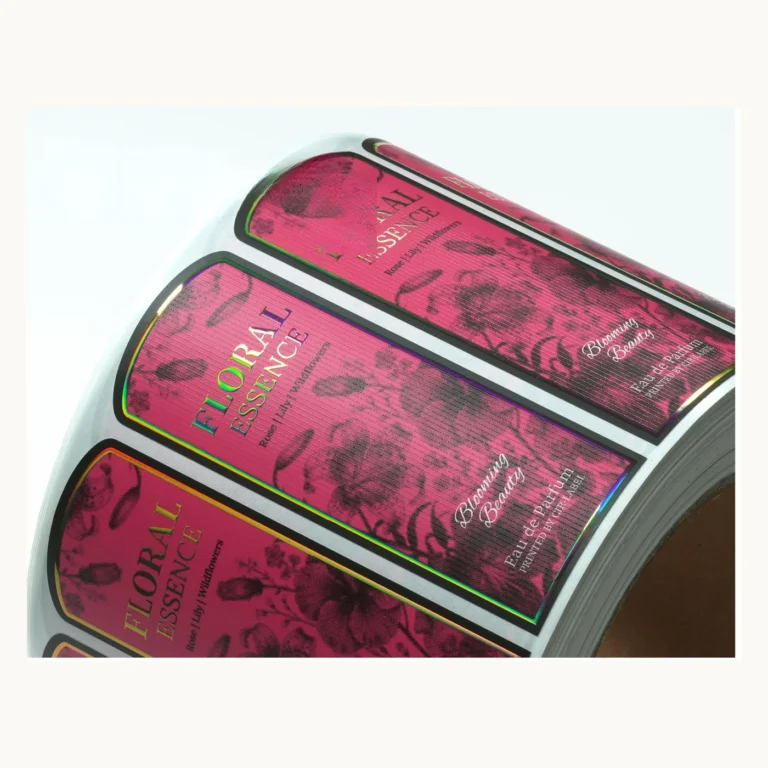 Photograph of Magenta Perfume Labels with Dark Botanical Drawing