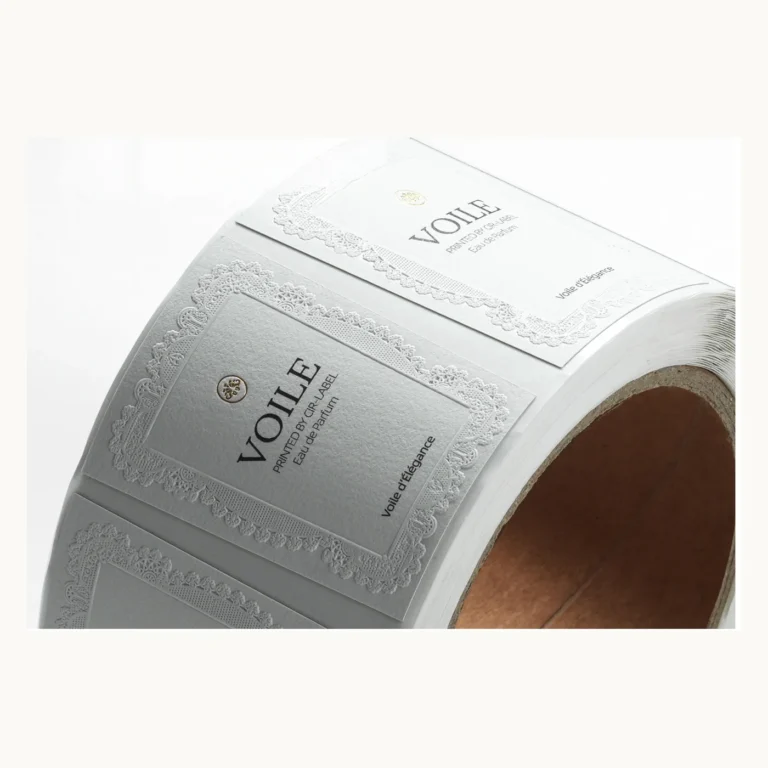 Photograph of White Perfume Labels with Blind Embossed Floral Border