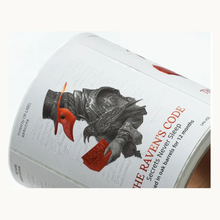 Photograph of Art Paper Wine Labels with Raven Illustration and Glow Detail