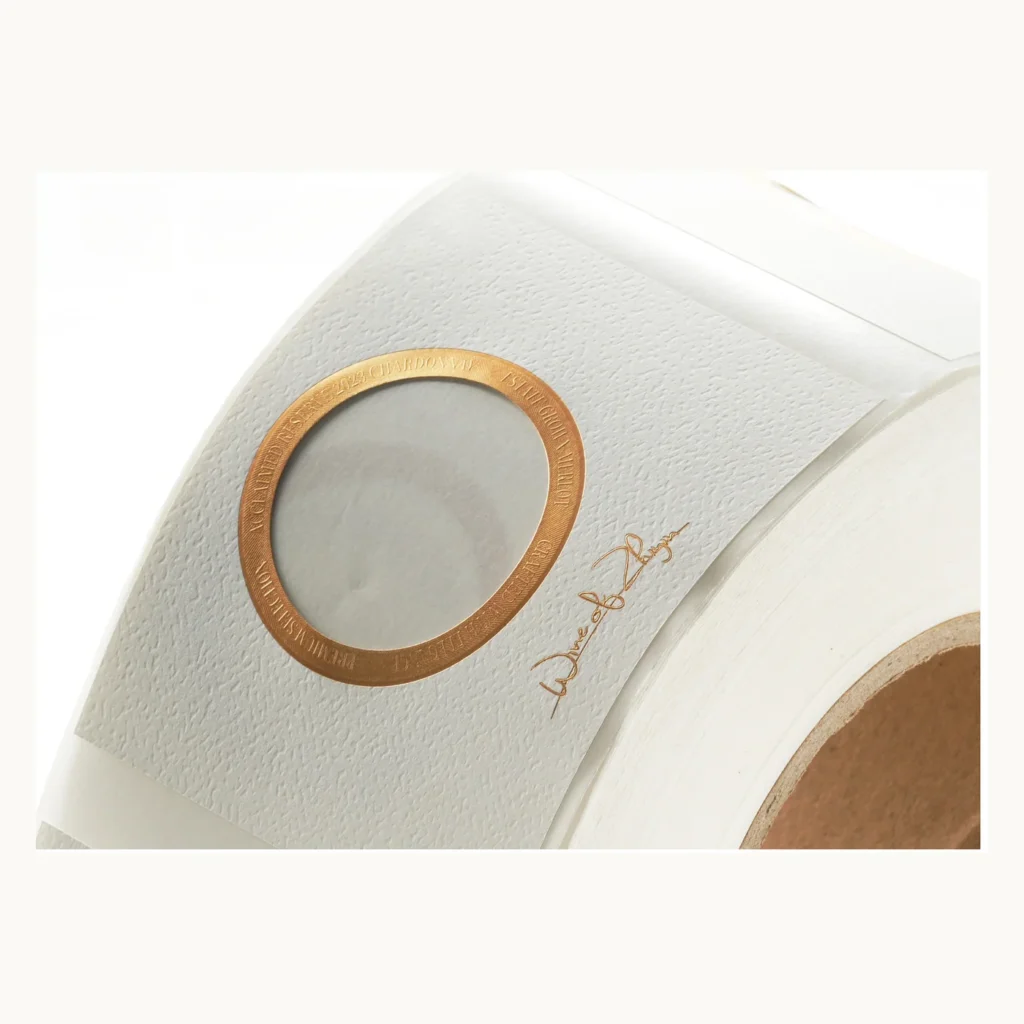 Photograph of White Felt Paper Wine Labels with Circular Gold Frame
