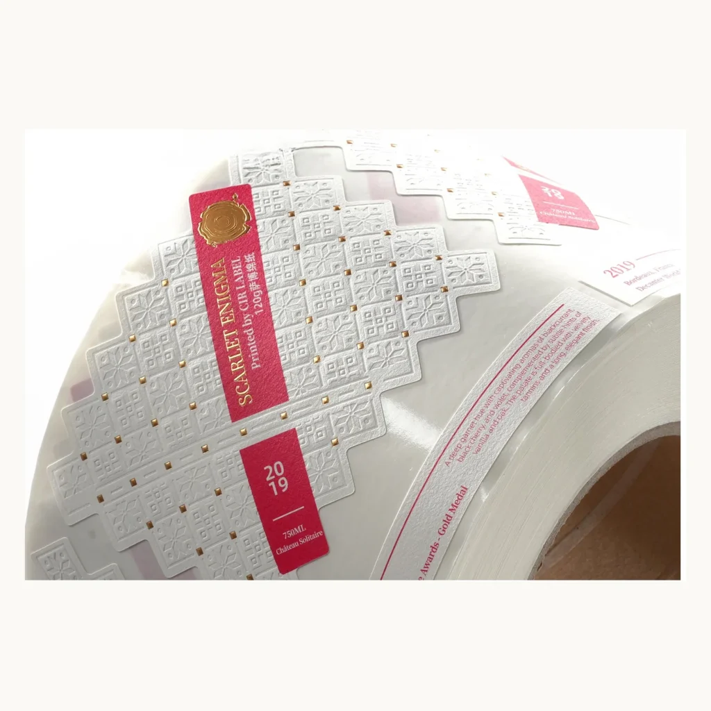 Photograph of White Wine Labels with Embossed Grid and Pink Strip