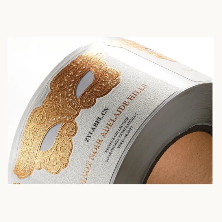 Photograph of Ornate Gold Mask Wine Labels on Cotton Paper