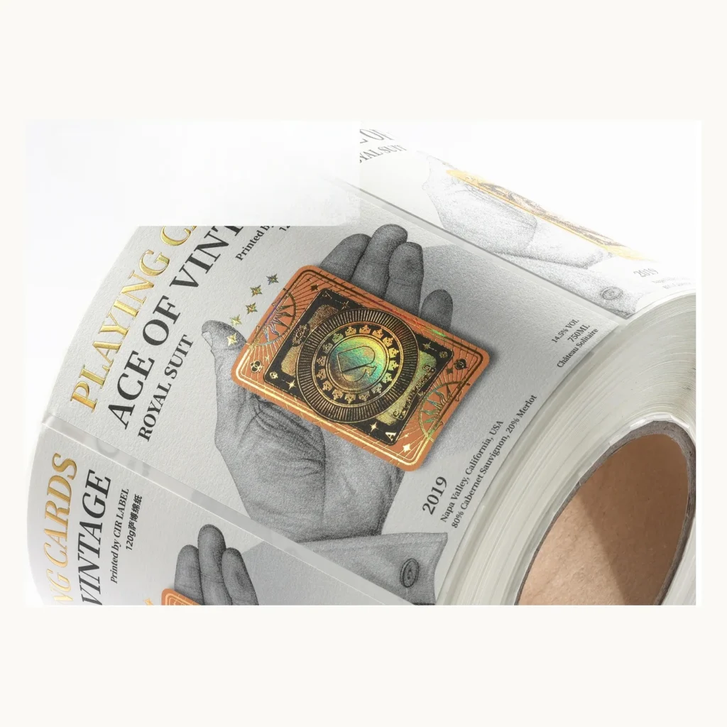 Photograph of Cream Wine Labels with Illustrated Hand and Gold Emblem