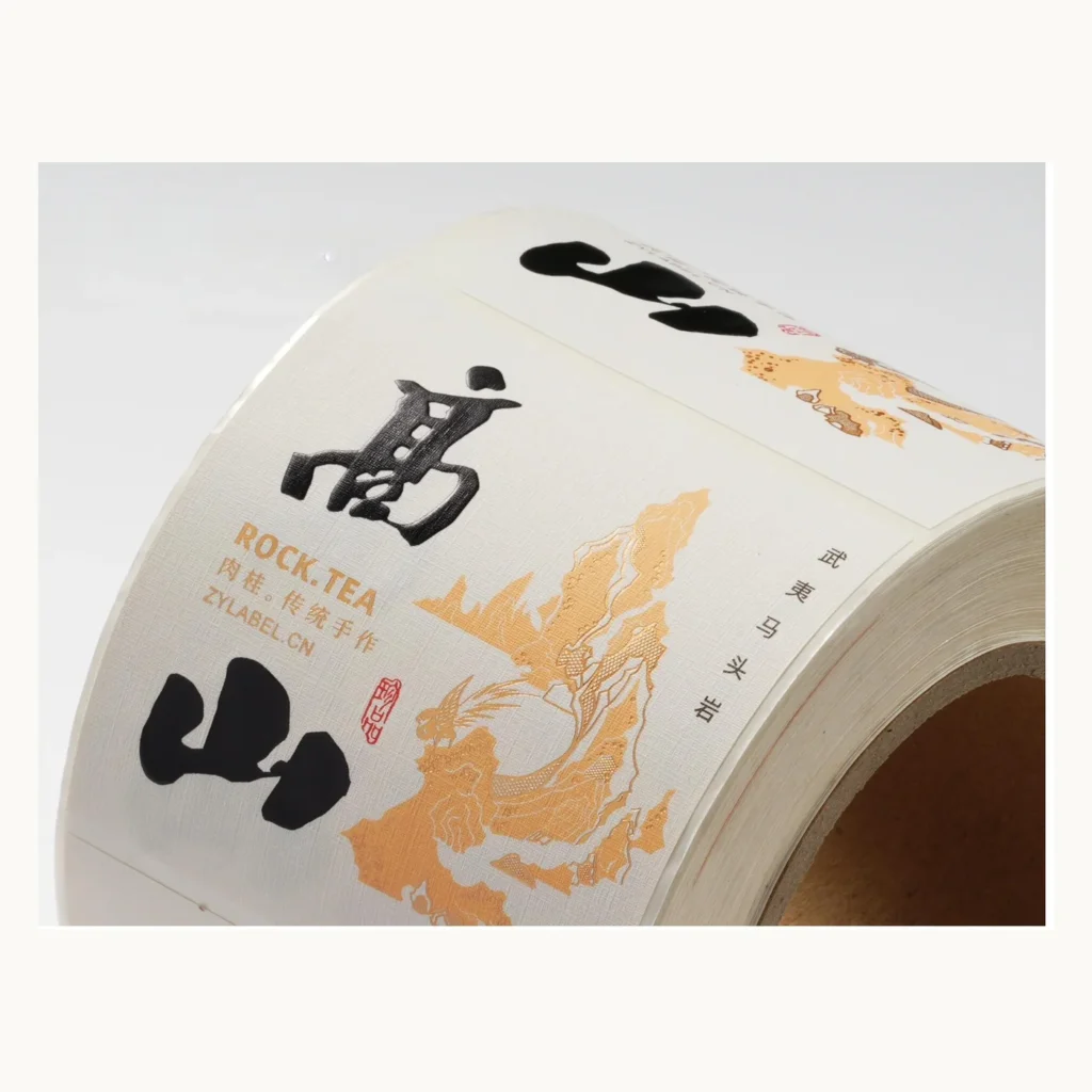 Photograph of Tea Labels with Mountain Drawing and Gold Calligraphy