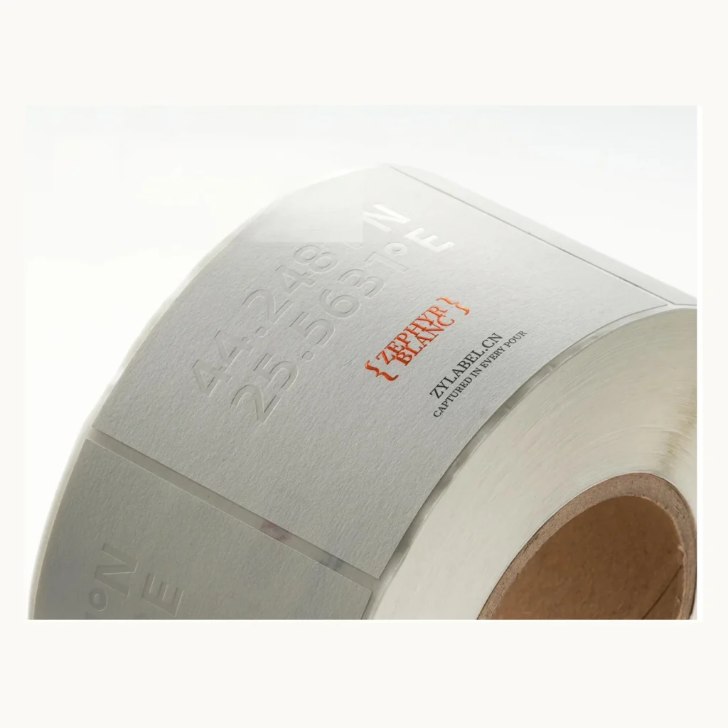 Photograph of Blind Embossed Cream Labels with Small Red Name