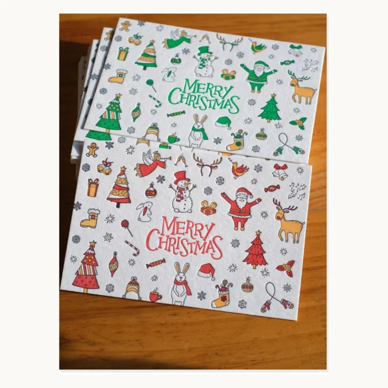 Photograph of Illustrated Christmas Postcards with Gold Foil Option