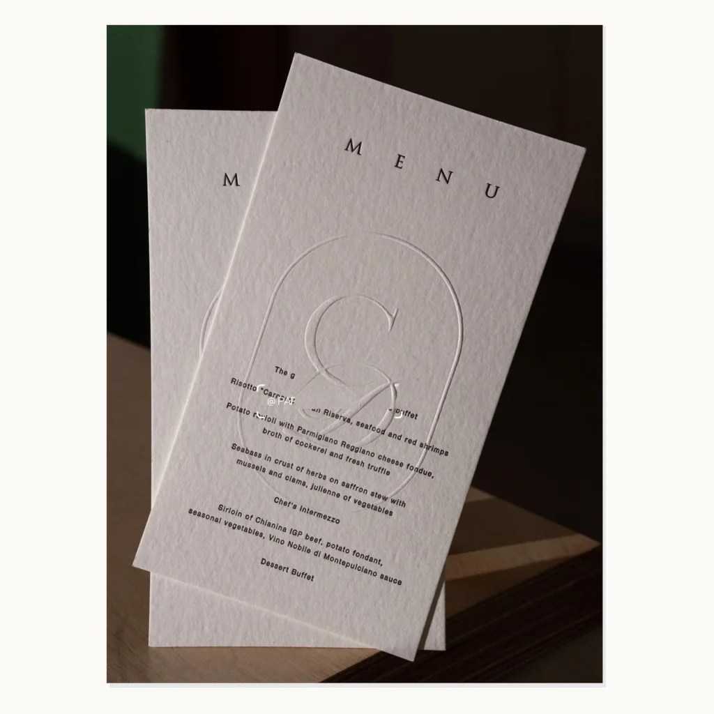 Photograph of Minimal White Art-Paper Letterpress Menus