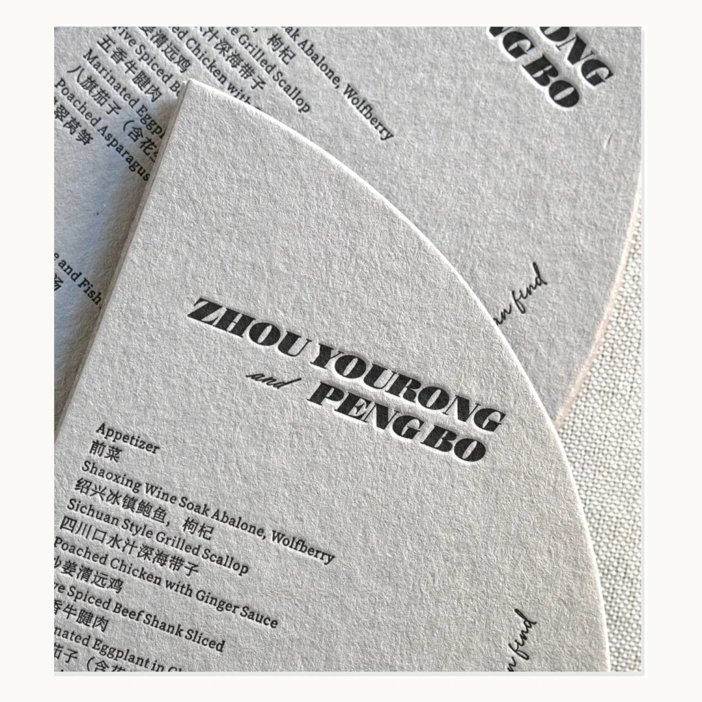 Photograph of Grey Die-Cut Wedding Menus with Letterpress Type