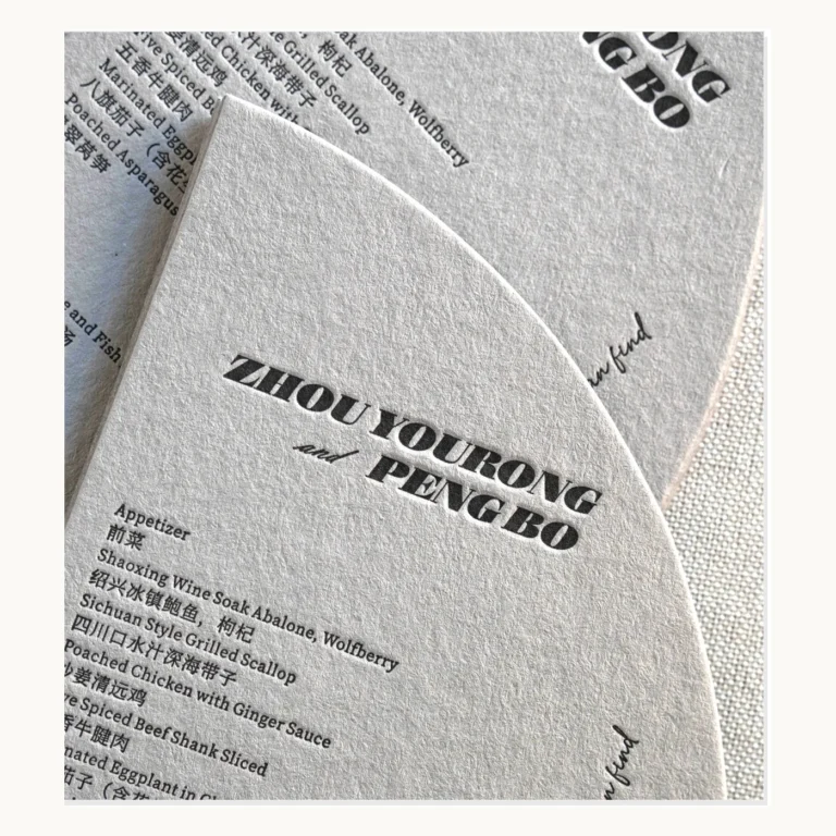 Photograph of Grey Die-Cut Wedding Menus with Letterpress Type