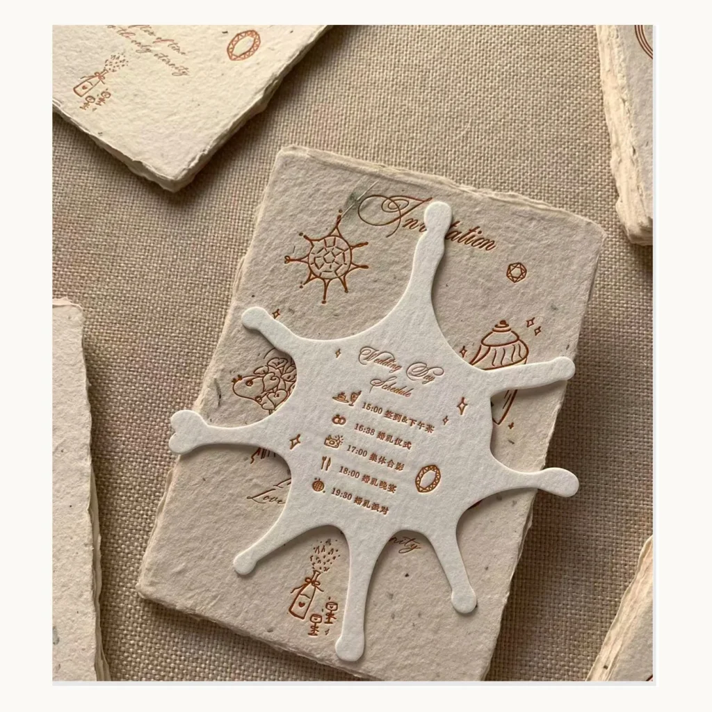 Photograph of Coastal Handmade-Paper Invitations with Sea Motifs