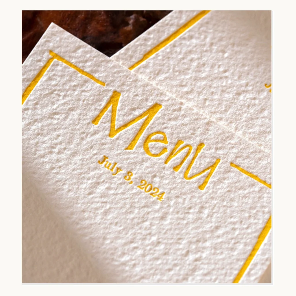 Photograph of Yellow and Black Letterpress Wedding Menus