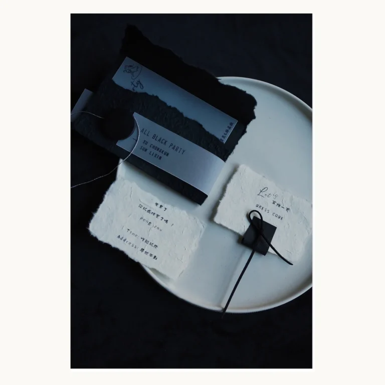 Photograph of Black Party Invitation Suite