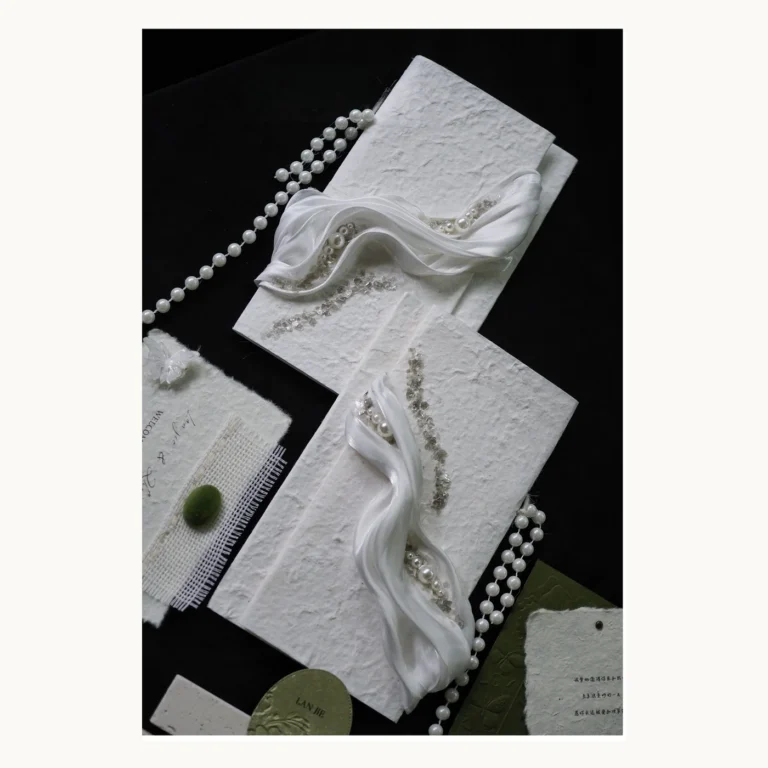 Photograph of Pearl White Draped Vow Books