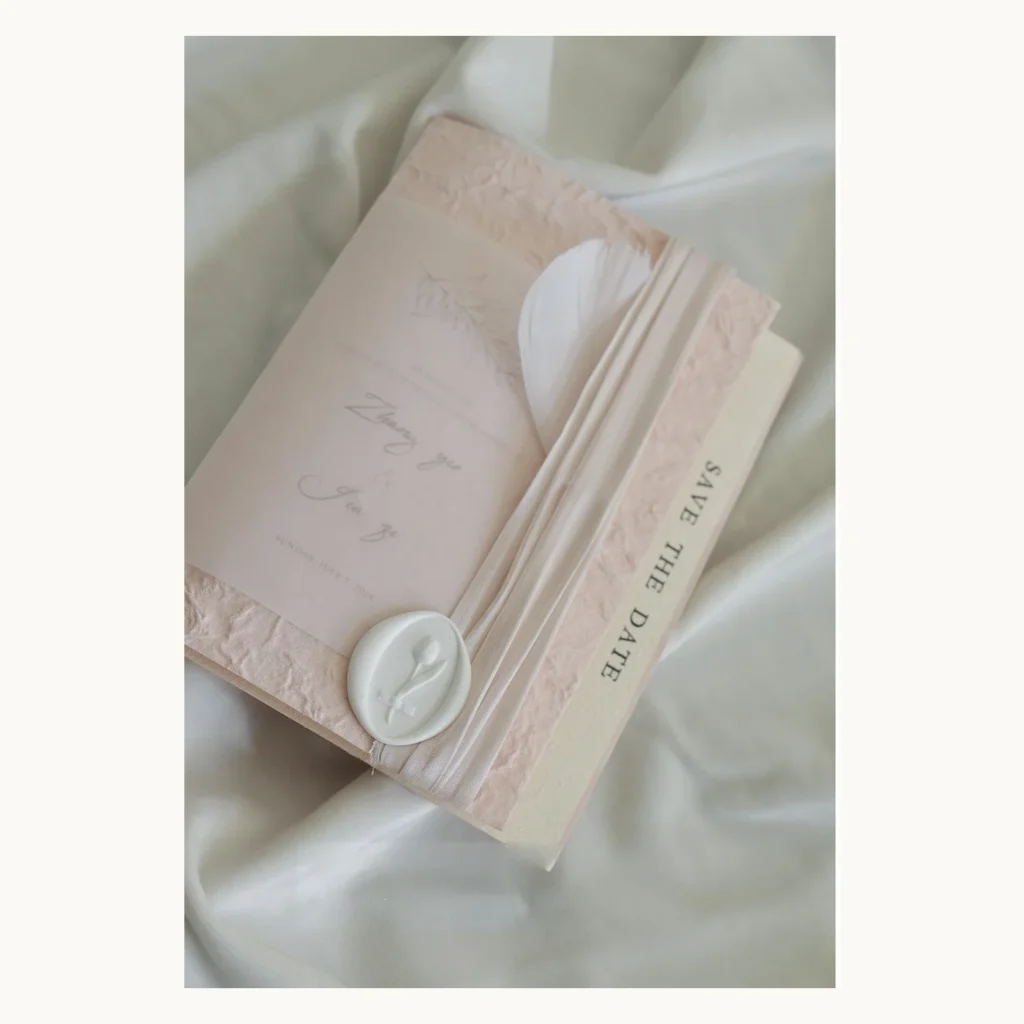 Photograph of Feather Pink Wedding Invitations
