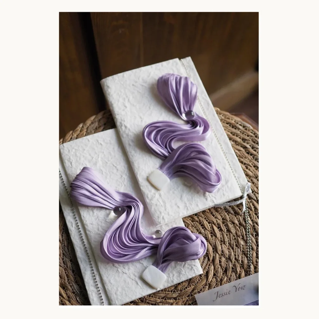 Photograph of Lavender Draped Wedding Vow Books