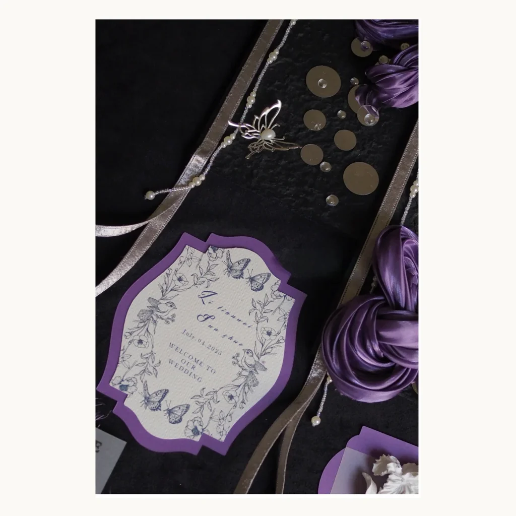 Photograph of Black and Violet Wedding Vow Books