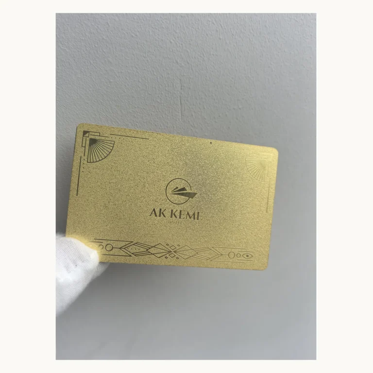 Photograph of Gold AK KEME Art Deco Metal Card