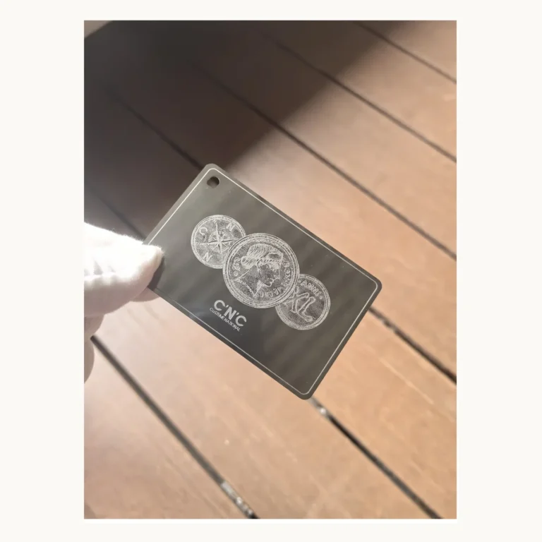 Photograph of Dark GNC Metal Card with Coin Motifs