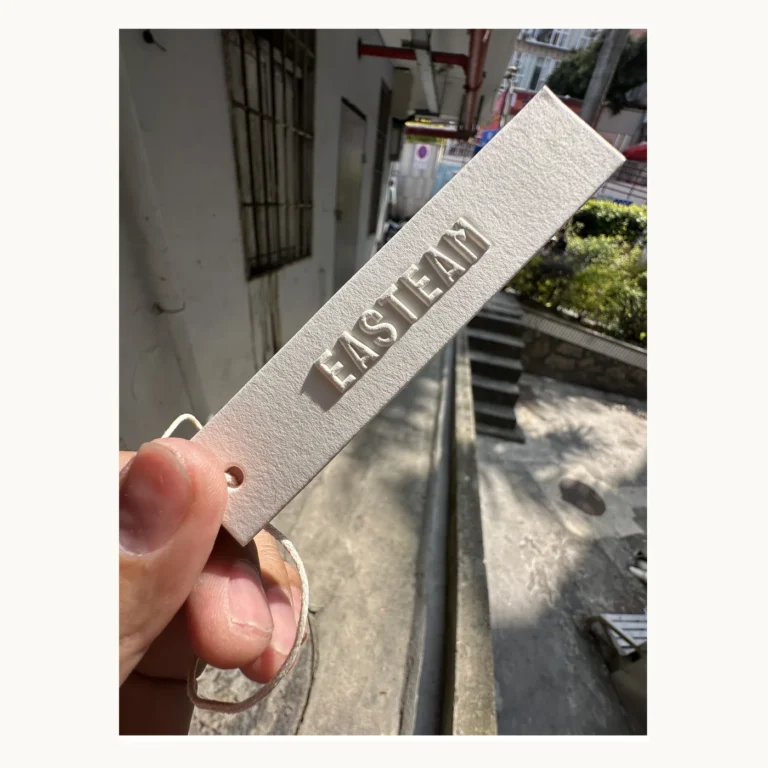 Photograph of EASTMAN Narrow White Hang Tag