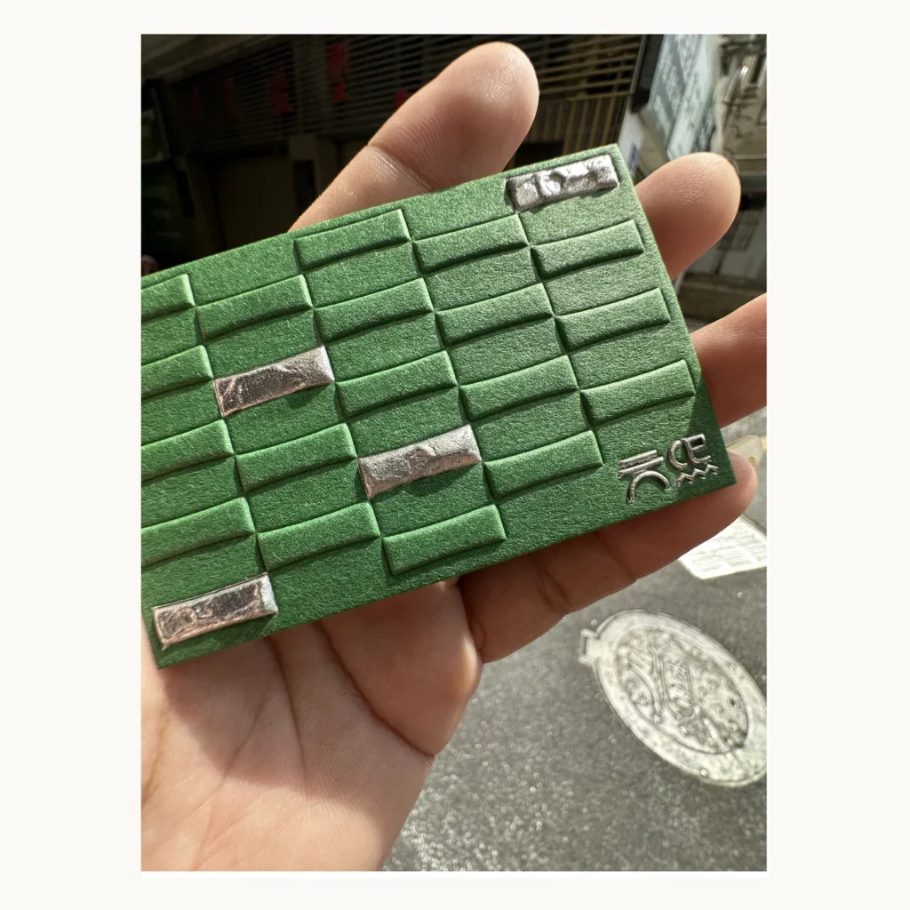 Photograph of Green Grid Relief Brand Card