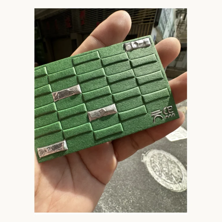 Photograph of Green Grid Relief Brand Card