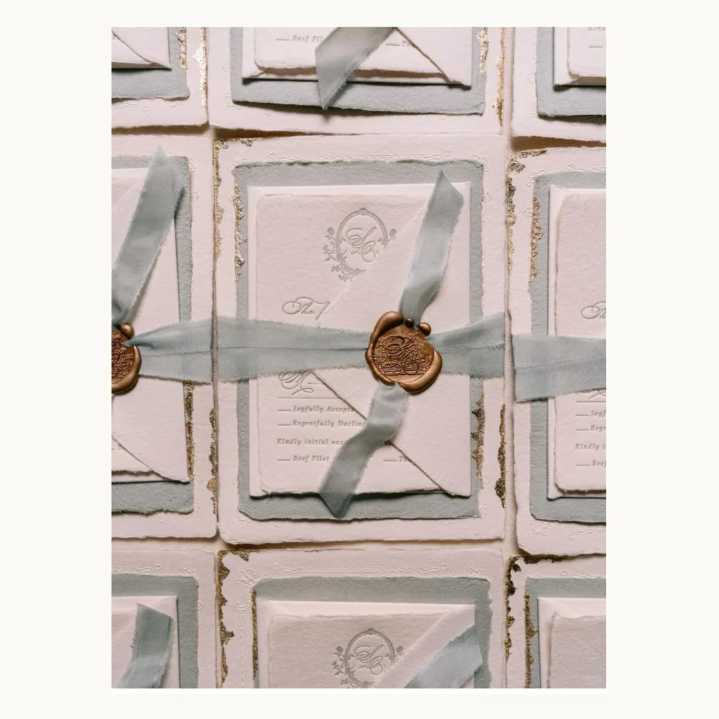 Photograph of Ribbon and Wax-Seal Wedding Invitation Suites