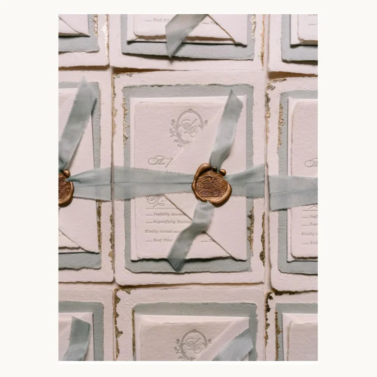 Photograph of Ribbon and Wax-Seal Wedding Invitation Suites