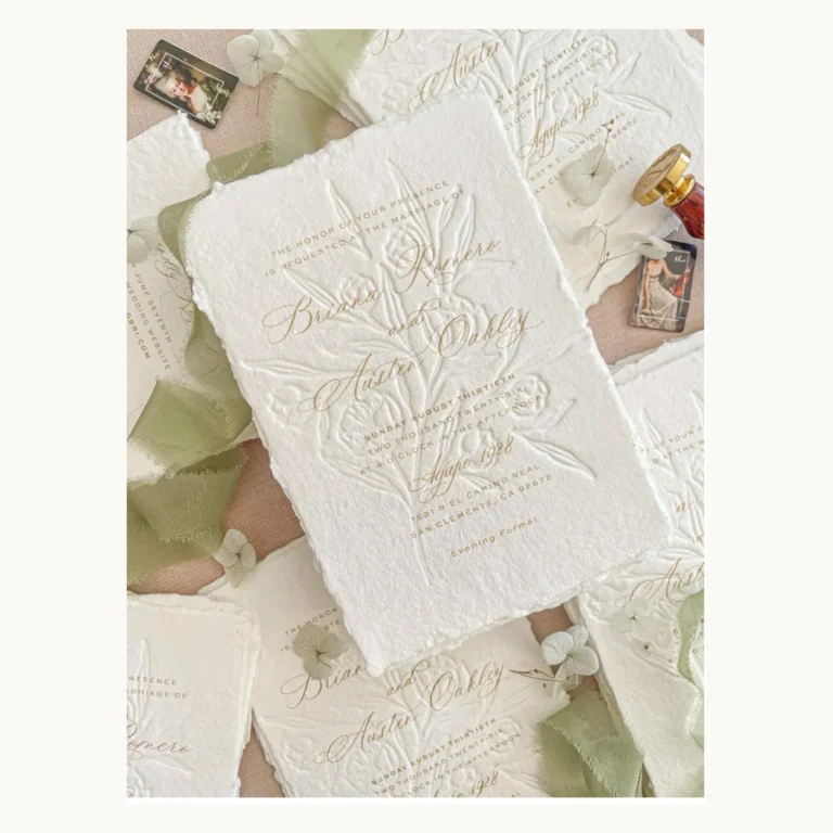 Photograph of Pale Botanical Relief Wedding Invitations