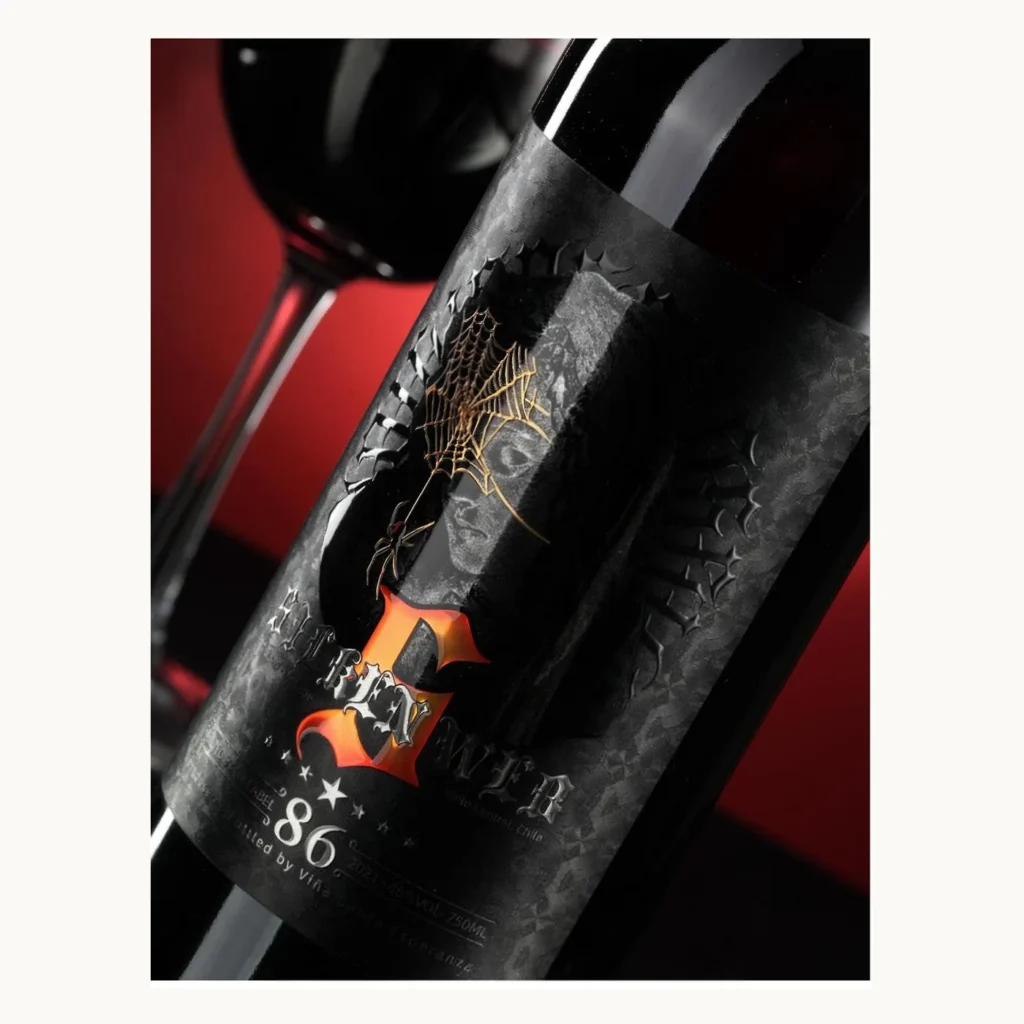 Photograph of Black Wine Bottle Labels with Sculpted Metallic Emblem