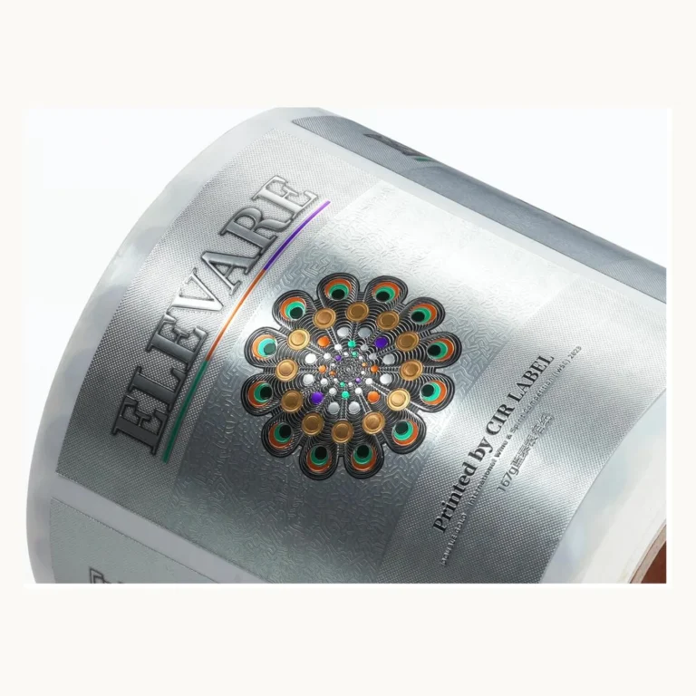 Photograph of Silver Perfume Labels with Iridescent Circular Artwork