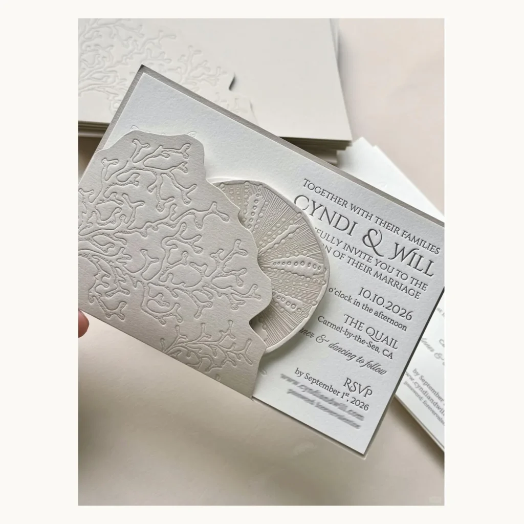 Photograph of Blind-Embossed Shell Wedding Invitations